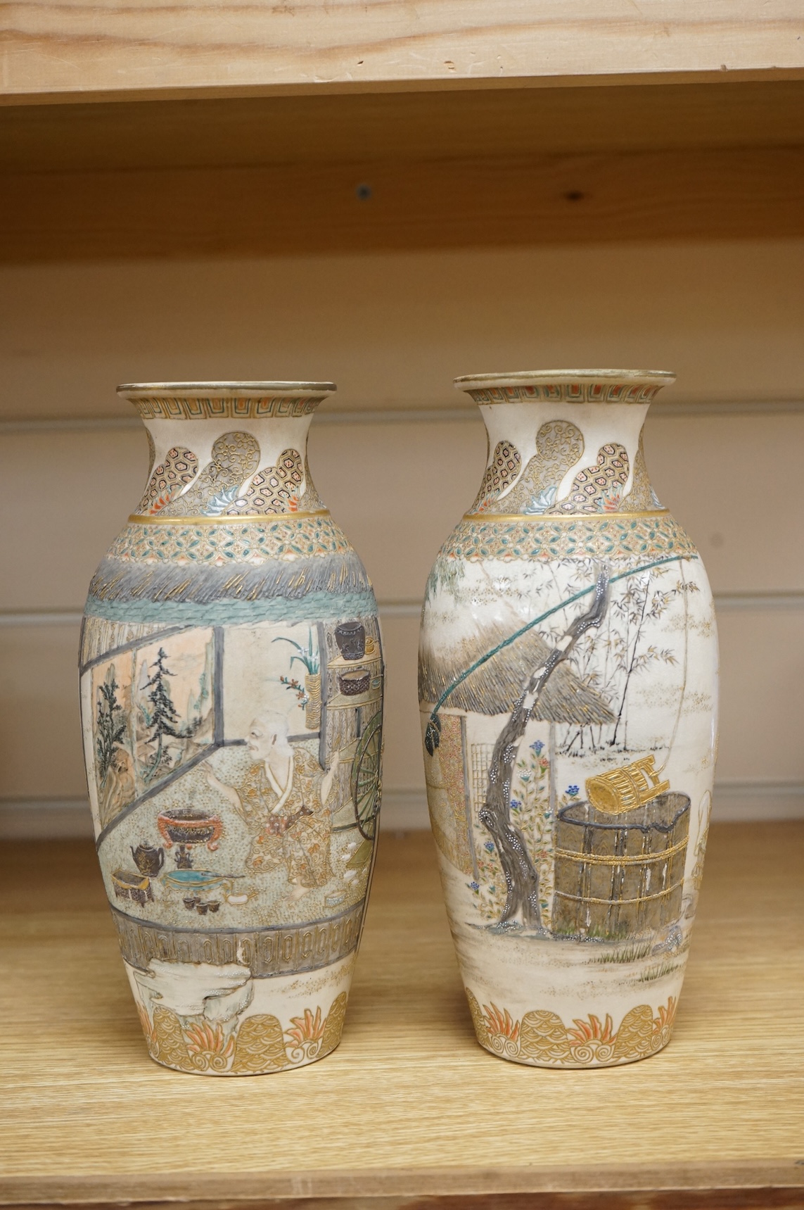 A pair of Japanese Satsuma vases,Meiji period, signed, 23cm